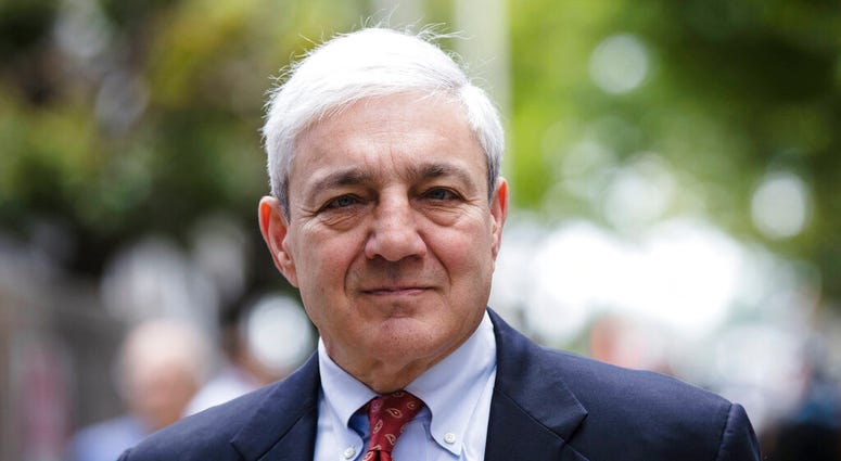 former Penn State President Graham Spanier departs after his sentencing hearing at the Dauphin County Courthouse in Harrisburg, Pa. A federal judge on Tuesday, April 30, 2019 has thrown out Spanier's child-endangerment conviction, less than a day before h former Penn State President Graham Spanier departs after his sentencing hearing at the Dauphin County Courthouse in Harrisburg, Pa. A federal judge on Tuesday, April 30, 2019 has thrown out Spanier's child-endangerment conviction, less than a day before h
