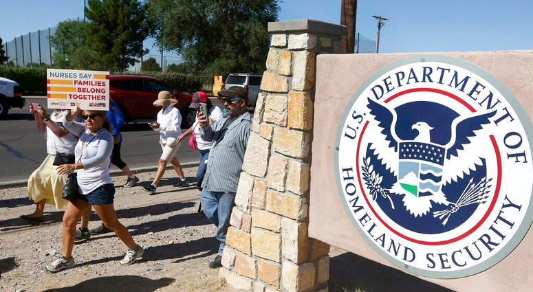 protesters walking along Montana Avenue outside the El Paso Processing Center in El Paso, Texas. protesters walking along Montana Avenue outside the El Paso Processing Center in El Paso, Texas.