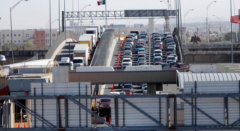 Cars and trucks line up to enter the U.S. from Mexico at a border crossing in El Paso, Texas, Cars and trucks line up to enter the U.S. from Mexico at a border crossing in El Paso, Texas,