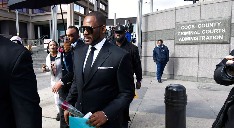 R. Kelly, front, leaves the Leighton Criminal Court after a hearing on Friday, March 22, 2019, in Chicago. R. Kelly, front, leaves the Leighton Criminal Court after a hearing on Friday, March 22, 2019, in Chicago.