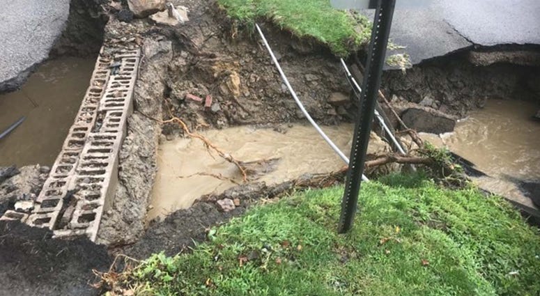 Heavy Rains Cause Sinkhole To Open Along McKnight Road Heavy Rains Cause Sinkhole To Open Along McKnight Road