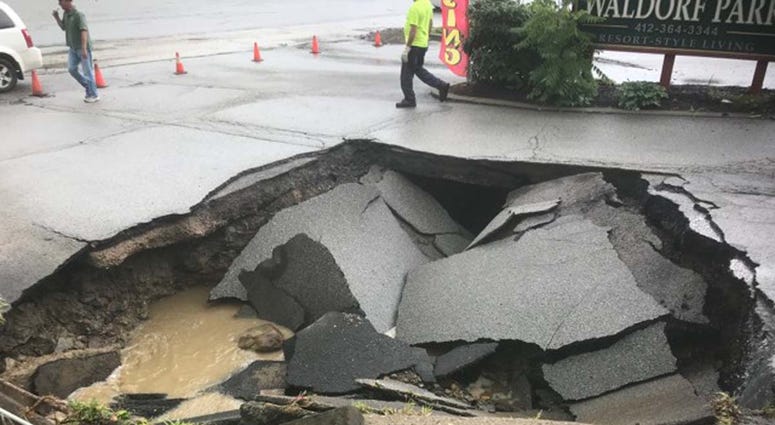 Heavy Rains Cause Sinkhole To Open Along McKnight Road Heavy Rains Cause Sinkhole To Open Along McKnight Road