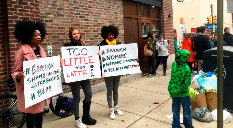 Protesters gather outside a Starbucks in Philadelphia Protesters gather outside a Starbucks in Philadelphia