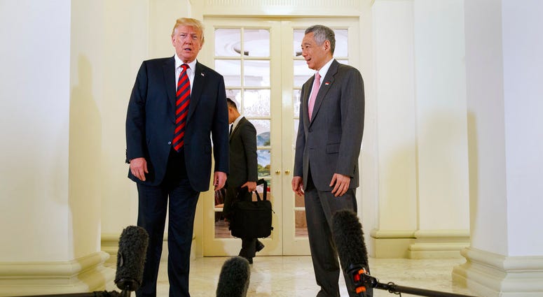 President Donald Trump meets with Singapore Prime Minister Lee Hsien Loong ahead of a summit with North Korean leader Kim Jong Un DO NOT USE