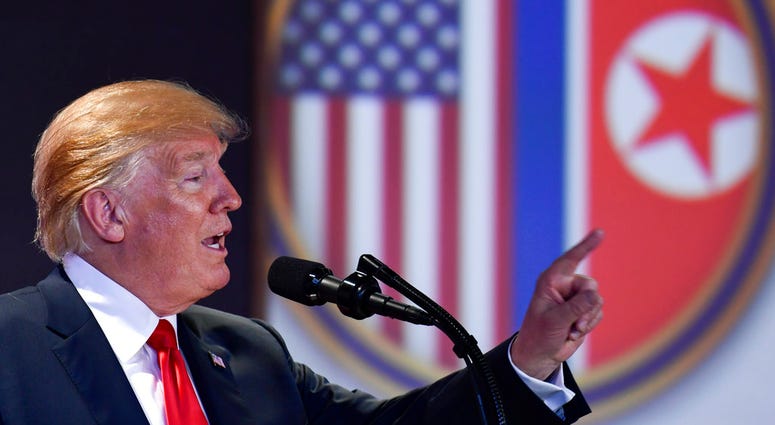 U.S. President Donald Trump answers questions about the summit with North Korea leader Kim Jong Un during a press conference at the Capella resort on Sentosa Island DO NOT USE