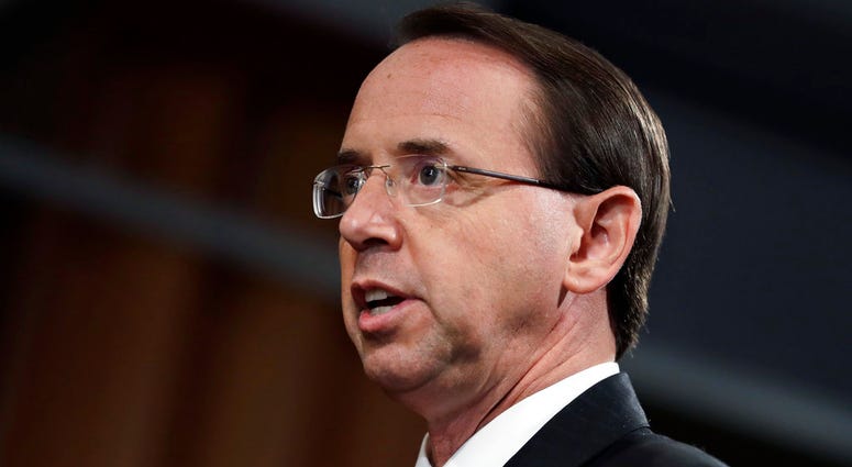 Deputy Attorney General Rod Rosenstein speaks during a news conference at the Department of Justice, Friday, July 13, 2018 DO NOT USE