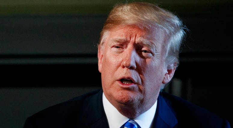 In this Aug. 9, 2018, photo, resident Donald Trump speaks during a meeting with state leaders about prison reform at Trump National Golf Club in Bedminster, N.J. DO NOT USE