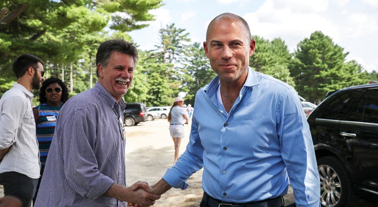 Michael Avenatti, right, an attorney and entrepreneur, arrives to speak at the Hillsborough County Democrats' Summer Picnic fundraiser in Greenfield, N.H. Sunday, Aug.19, 2018. DO NOT USE