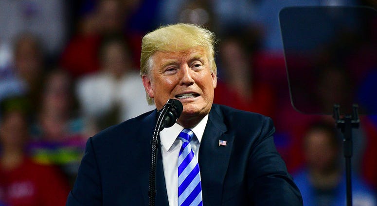 President Donald Trump speaks during a rally Tuesday, Aug. 21, 2018, at the Civic Center in Charleston W.Va. DO NOT USE