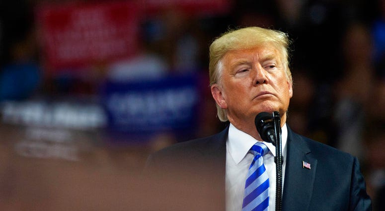 President Donald Trump takes the stage at a rally in support of the Senate candidacy of West Virginia's Attorney General Patrick Morrisey, Tuesday, Aug. 21, 2018, at the Charleston Civic Center in Charleston, W.Va. DO NOT USE