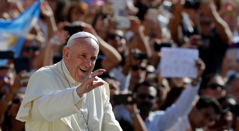 Pope Francis salutes as he arrives for his weekly general audience, at the Vatican, Wednesday, Aug. 29, 2018. DO NOT USE