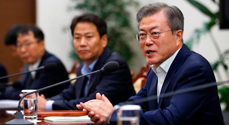In this Thursday, Sept. 6, 2018 photo, South Korean President Moon Jae-in, right, speaks during a meeting to make preparations for upcoming summit between South and North Korea in Pyongyang, North Korea. DO NOT USE