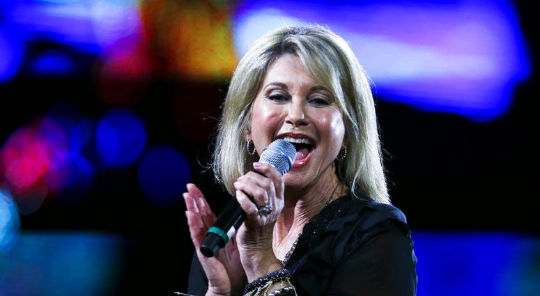 In this Feb. 23, 2017, file photo, Olivia Newton-John performs during the Viña del Mar International Song Festival at the Quinta Vergara in Viña del Mar, Chile. DO NOT USE