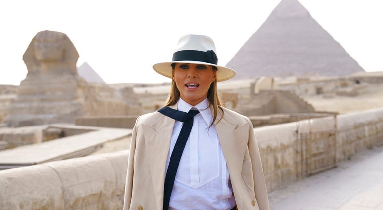 U.S. first lady Melania Trump talks to media as she visits the ancient statue of Sphinx, with the body of a lion and a human head, at the historic Giza Pyramids site near Cairo DO NOT USE