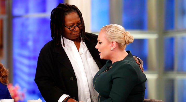 This image released by ABC shows co-host Meghan McCain right, being comforted by fellow co-host Whoopi Goldberg during her first appearance on "The View," in New York DO NOT USE