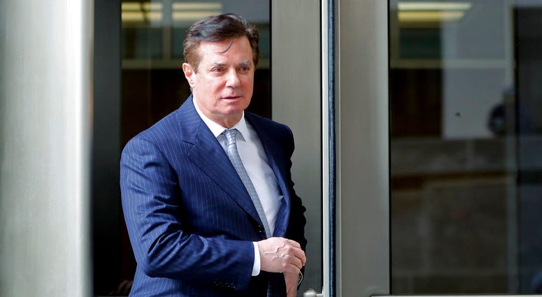 In this Feb. 14, 2018 file photo, Paul Manafort, President Donald Trump's former campaign chairman, leaves the federal courthouse in Washington. DO NOT USE