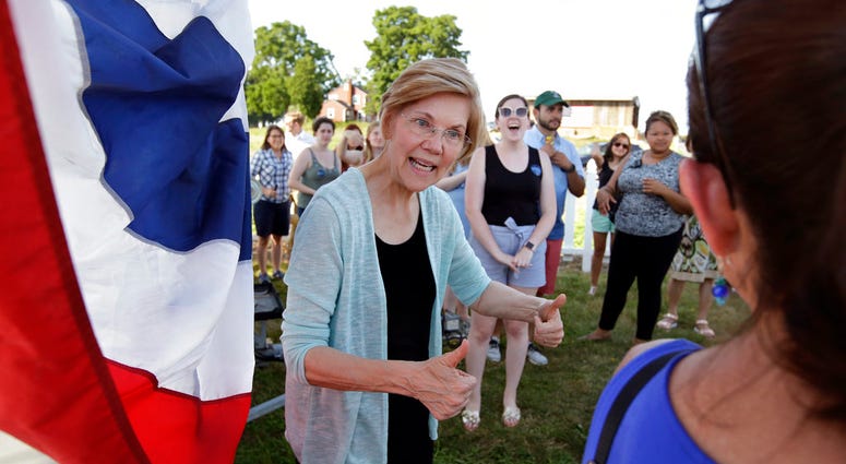 n this July 8, 2018, file photo, Sen. Elizabeth Warren, D-Mass., greets people following a town hall event at Belkin Family Lookout Farm DO NOT USE