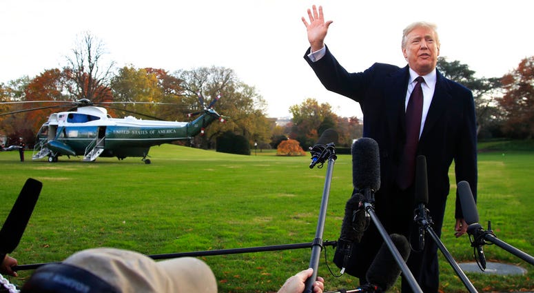 President Donald Trump speaks to the media before leaving the White House in Washington President Donald Trump speaks to the media before leaving the White House in Washington
