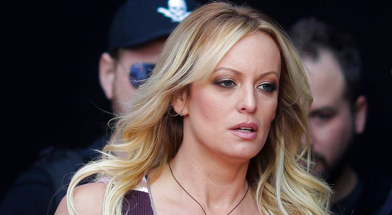 In this Oct. 11, 2018, file photo, adult film actress Stormy Daniels arrives for the opening of the adult entertainment fair "Venus," in Berlin. DO NOT USE