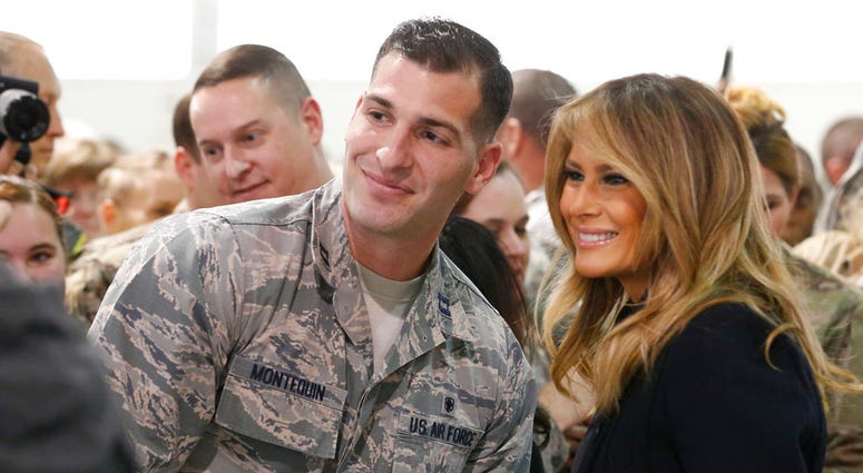 First lady Melania Trump , right, poses with an airman during a tour of Joint Base Langley in Hampton, Va., Wednesday, Dec. 12, 2018. First lady Melania Trump , right, poses with an airman during a tour of Joint Base Langley in Hampton, Va., Wednesday, Dec. 12, 2018.