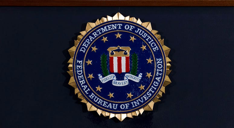 The FBI seal is seen before a news conference at FBI headquarters in Washington. The FBI seal is seen before a news conference at FBI headquarters in Washington.