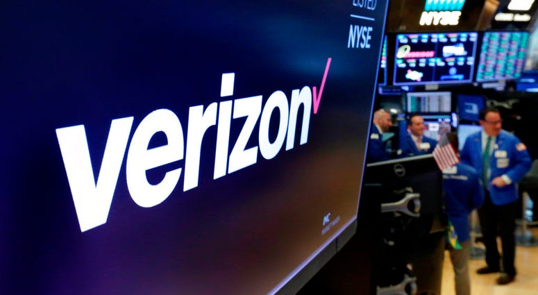 This April 23, 2018, file photo shows the logo for Verizon above a trading post on the floor of the New York Stock Exchange. DO NOT USE