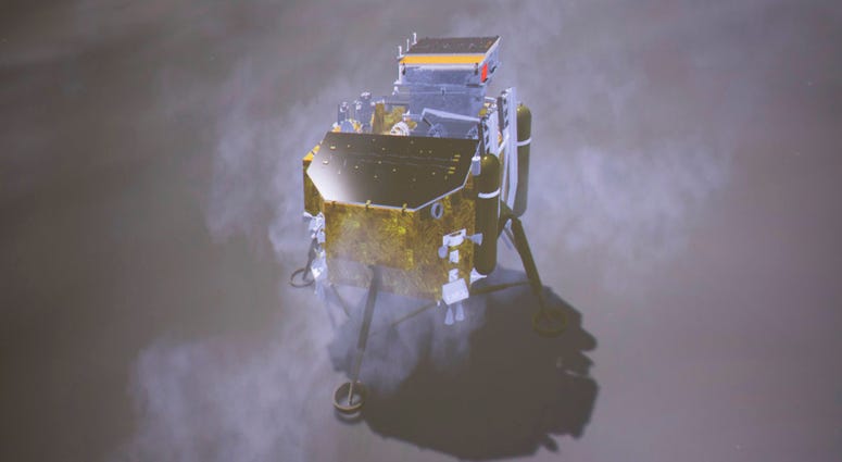 In this image provided on Jan. 3, 2019, by China's Xinhua News Agency, a simulated landing process of Chang'e-4 lunar probe is seen through the monitor at Beijing Aerospace Control Center in Beijing. DO NOT USE