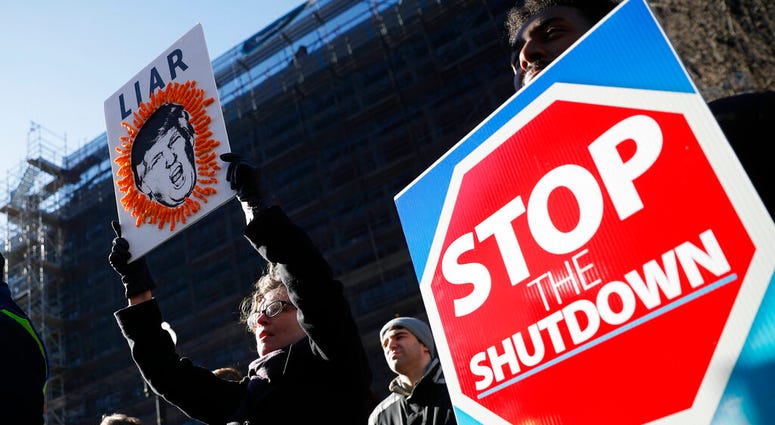 Union members and other federal employees rally to call for an end to the partial government shutdown, Thursday, Jan. 10, 2019 at AFL-CIO Headquarters in Washington. DO NOT USE