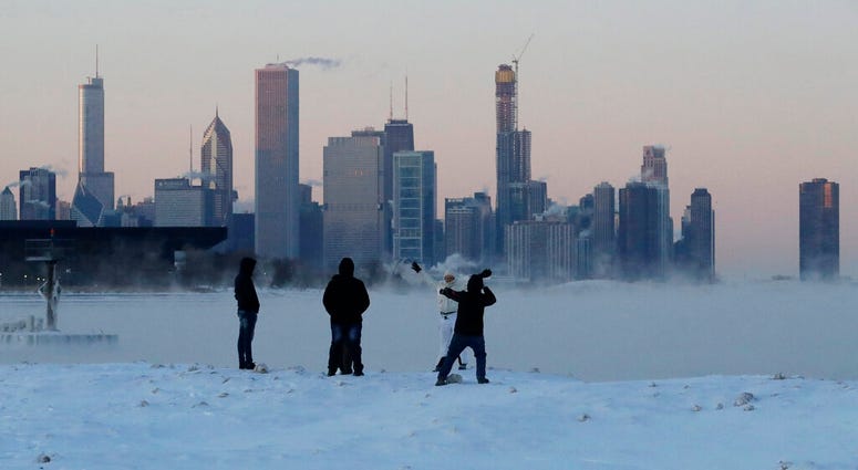 People enjoy at the Lake Michigan at 31st Street Harbor, Wednesday, Jan. 30, 2019, in Chicago. DO NOT USE