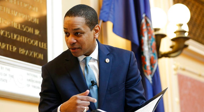 Virginia Lt. Gov Justin Fairfax looks over a briefing book prior to the start of the senate session at the Capitol in Richmond, Va., Thursday, Feb. 7, 2019 Virginia Lt. Gov Justin Fairfax looks over a briefing book prior to the start of the senate session at the Capitol in Richmond, Va., Thursday, Feb. 7, 2019