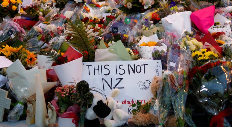 In this Saturday, March 16, 2019, file photo, flowers lay at a memorial near the Masjid Al Noor mosque for victims in last week's shooting in Christchurch, New Zealand. AP DO NOT USE