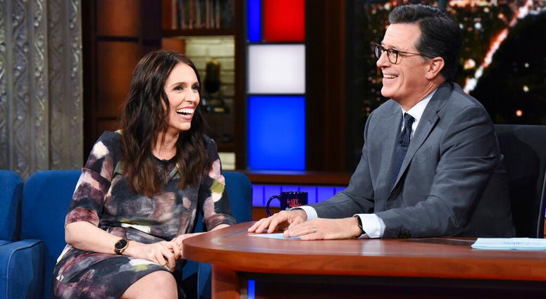 This Sept. 26, 2018 photo release by CBS shows New Zealand Prime Minister Jacinda Ardern, left, with host Stephen Colbert during a taping of "The Late Show with Stephen Colbert," in New York. AP DO NOT USE