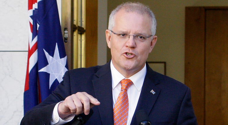 In this Feb. 13, 2019, file photo Australian Prime Minister Scott Morrison addresses media at Parliament House in Canberra. Morrison, on Tuesday, March 26, 2019, accused an influential minor political party of trying to "sell Australia's gun laws " AP DO NOT USE