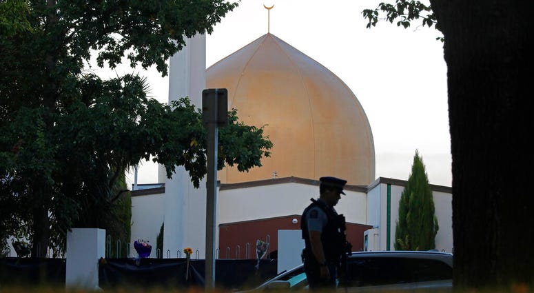 In this March 17, 2019, file photo, a police officer stands guard in front of the Al Noor mosque in Christchurch, New Zealand. AP DO NOT USE