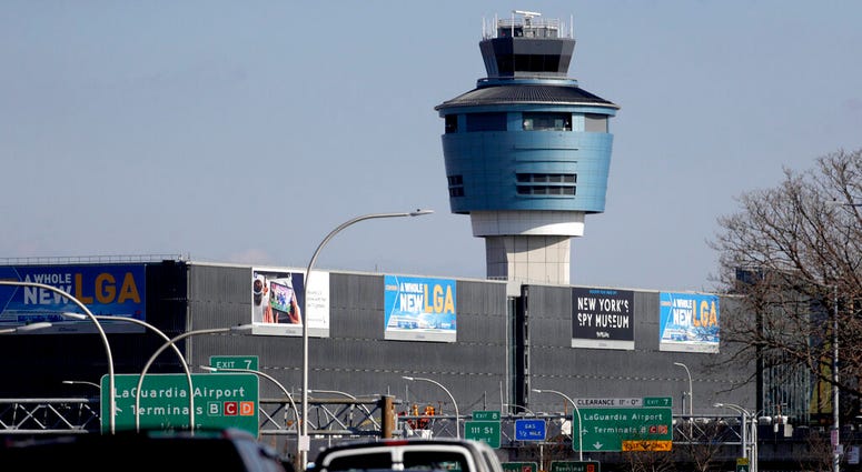 This Friday, Jan. 25, 2019 file photo shows the air traffic control tower at LaGuardia Airport in New York. AP DO NOT USE