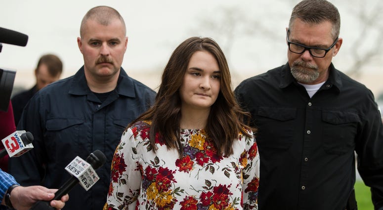Santana Renee Adams is escorted into Cabell County Magistrate Court to be arraigned on charges for falsely reporting an emergency incident, Friday, April 5, 2019, AP DO NOT USE