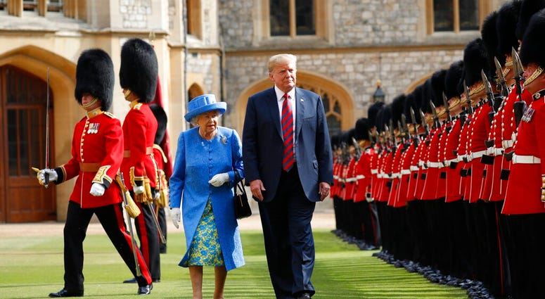 In this Friday, July 13, 2018 file photo, U.S. President Donald Trump and Britain's Queen Elizabeth inspects the Guard of Honour at Windsor Castle in Windsor, England. AP DO NOT USE