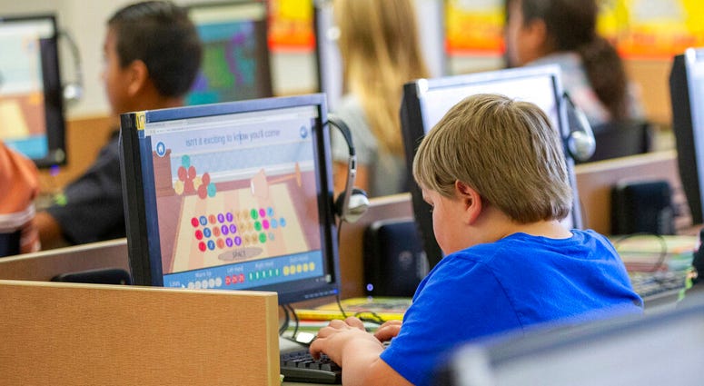 In this Oct. 29, 2018 file photo, students work on computers at an elementary school in Beaver, Utah. AP DO NOT USE