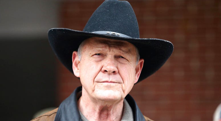 n this Dec. 12, 2017, file photo, Roy Moore speaks to the media after he rode in on a horse to vote in Gallant, Ala. Moore says he’s considering a fresh run for Senate in 2020. AP DO NOT USE