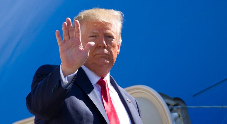 President Donald Trump waves as he boards Air Force One President Donald Trump waves as he boards Air Force One