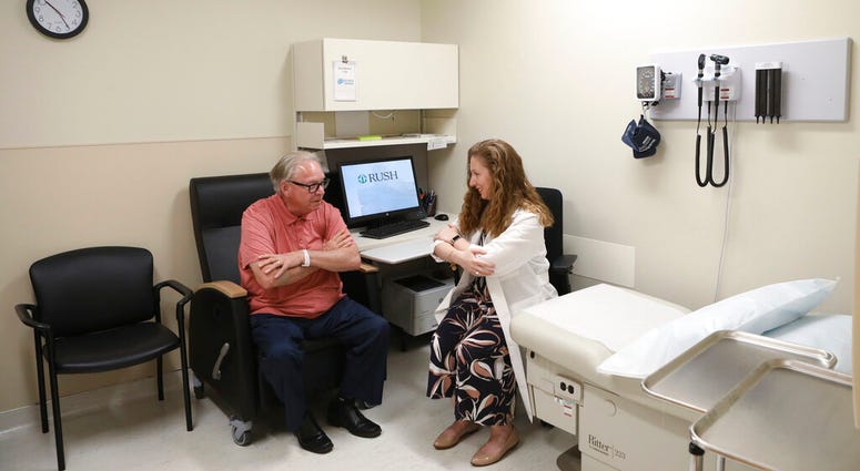 Dr. Jori Fleisher, neurologist, examines Thomas Doyle, 66, at the Rush University Medical Center in Chicago. Doyle, 66, hopes blood tests may someday replace the invasive diagnostic testing he endured to be diagnosed 4.5 years ago with Lewy body dementia. AP DO NOT USE