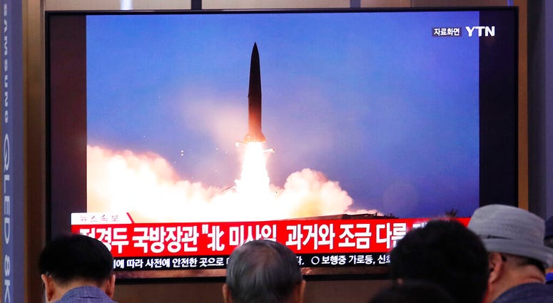People watch a TV showing a file image of North Korea's missile launch during a news program at the Seoul Railway Station in Seoul, South Korea, Wednesday, July 31, 2019. AP DO NOT USE