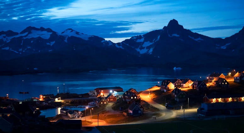 homes are illuminated after the sunset in Tasiilaq, Greenland. ( homes are illuminated after the sunset in Tasiilaq, Greenland. (