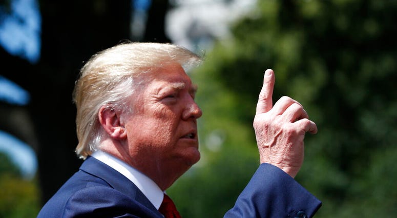 President Donald Trump speaks with reporters before departing on Marine One on the South Lawn of the White House, Wednesday, Aug. 21, 2019, in Washington. Trump is headed to Kentucky.
