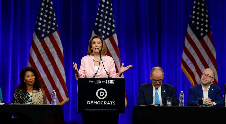 U.S. House Speaker Nancy Pelosi gestures while speaking at the Democratic National Committee's summer meeting Friday, Aug. 23, U.S. House Speaker Nancy Pelosi gestures while speaking at the Democratic National Committee's summer meeting Friday, Aug. 23,