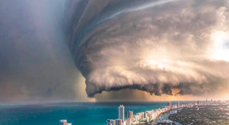 This image shows a digitally-created illustration depicting a storm approaching Miami Beach by artist Brent Shavnore, posted on his Instagram account on April 12, 2019. AP DO NOT USE