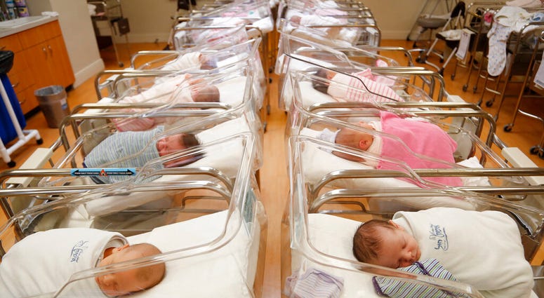 In this Feb. 16, 2017, file photo newborns rest in the nursery of Aishes Chayil, a postpartum recovery center, in Kiryas Joel, N.Y.