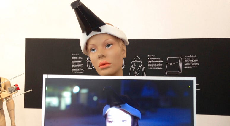 This 2017 photo provided by artist Jing-cai Liu shows her work titled "Wearable Face Projector" at a gallery in Utrecht, Netherlands. AP DO NOT USE