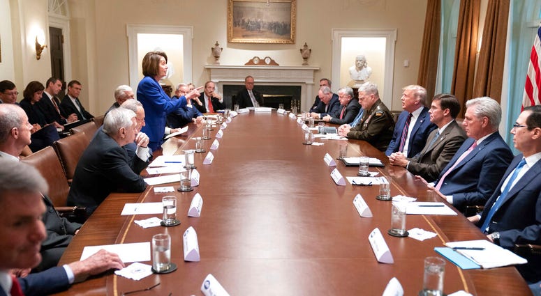 President Donald Trump, center right, meets with House Speaker Nancy Pelosi, standing left, Congressional leadership and others, Wednesday, Oct. 16, 2019, in the Cabinet Room of the White House in Washington. President Donald Trump, center right, meets with House Speaker Nancy Pelosi, standing left, Congressional leadership and others, Wednesday, Oct. 16, 2019, in the Cabinet Room of the White House in Washington.