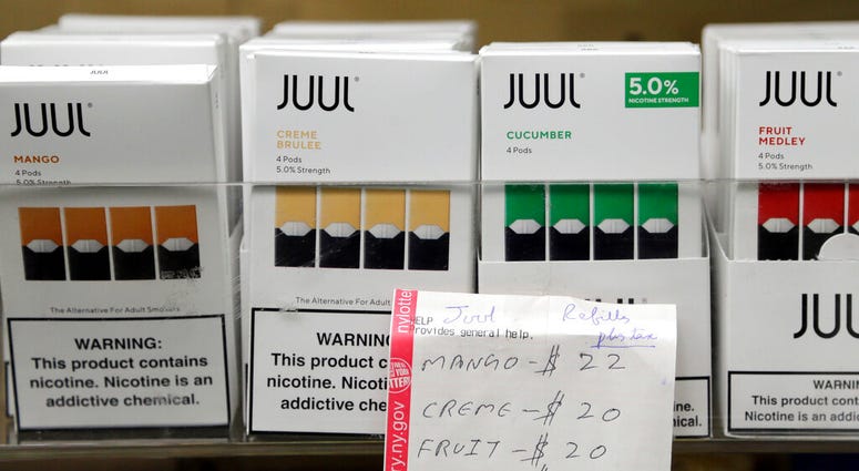 Juul products are displayed at a smoke shop in New York. On Thursday, Oct. 17, 2019, the company announced it will voluntarily stop selling its fruit and dessert-flavored vaping pods. Juul products are displayed at a smoke shop in New York. On Thursday, Oct. 17, 2019, the company announced it will voluntarily stop selling its fruit and dessert-flavored vaping pods.